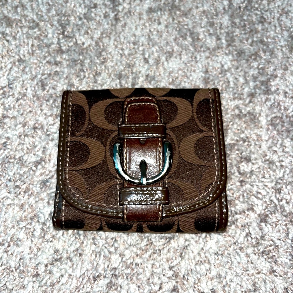 Coach bi-fold chocolate brown wallet.